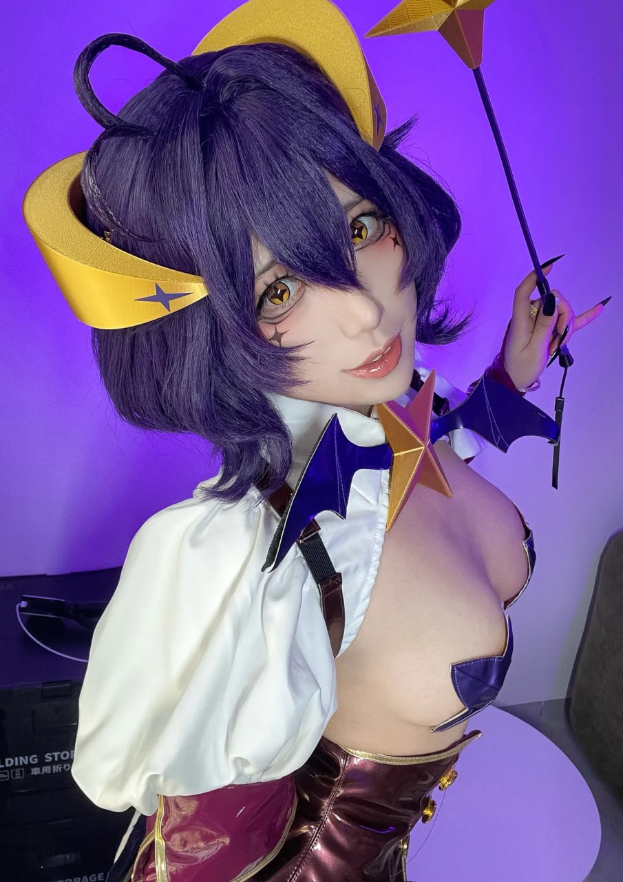 Cosplay Cutie Flaunts Massive Tits Cosplay cutie flaunts massive tits in revealing top.