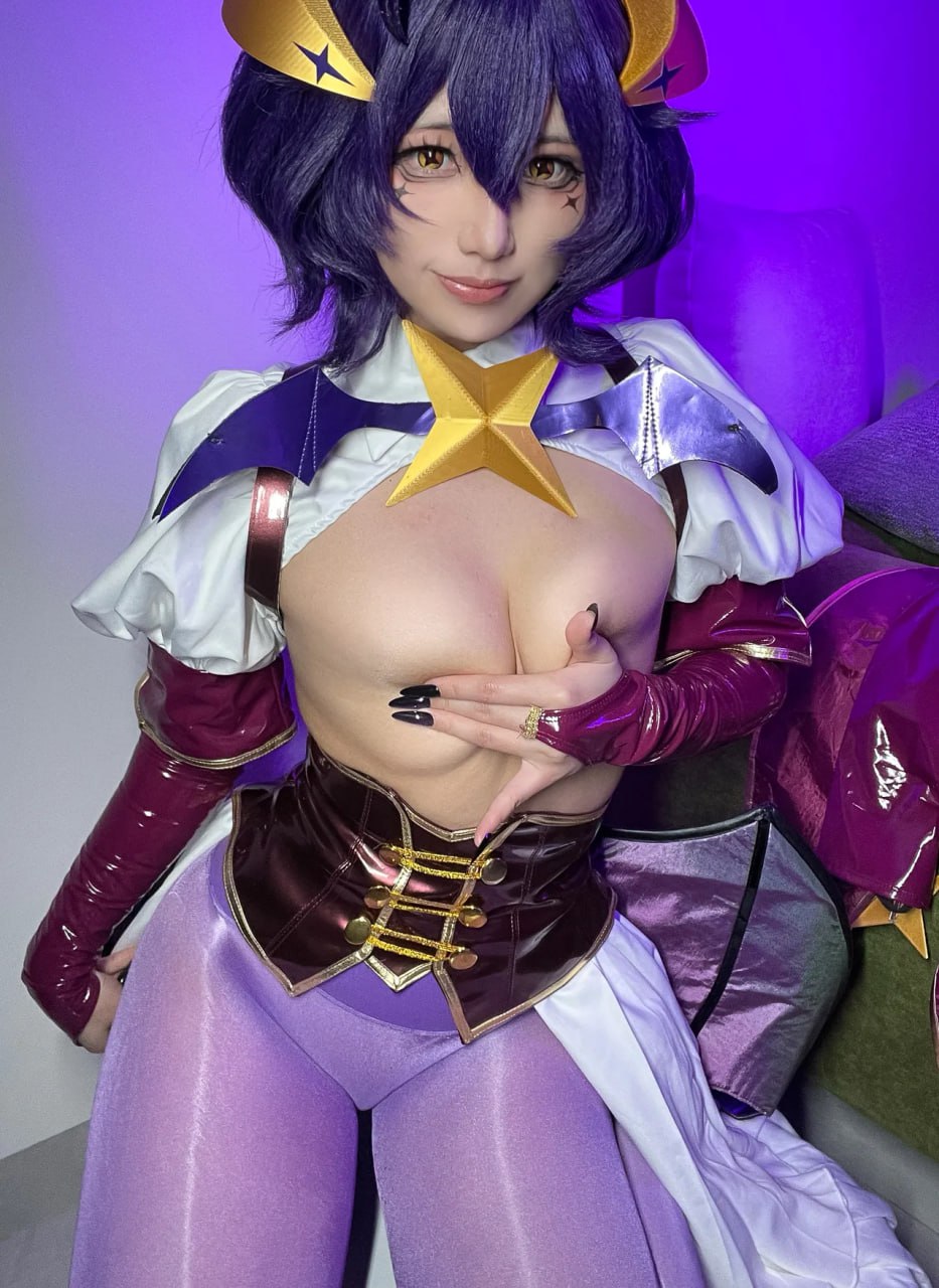 Cosplay Cutie in Revealing Costume with Sexy Breasts and Tight Purple Leggings Cosplay cutie flaunts her sexy breasts in a revealing costume with tight purple leggings.