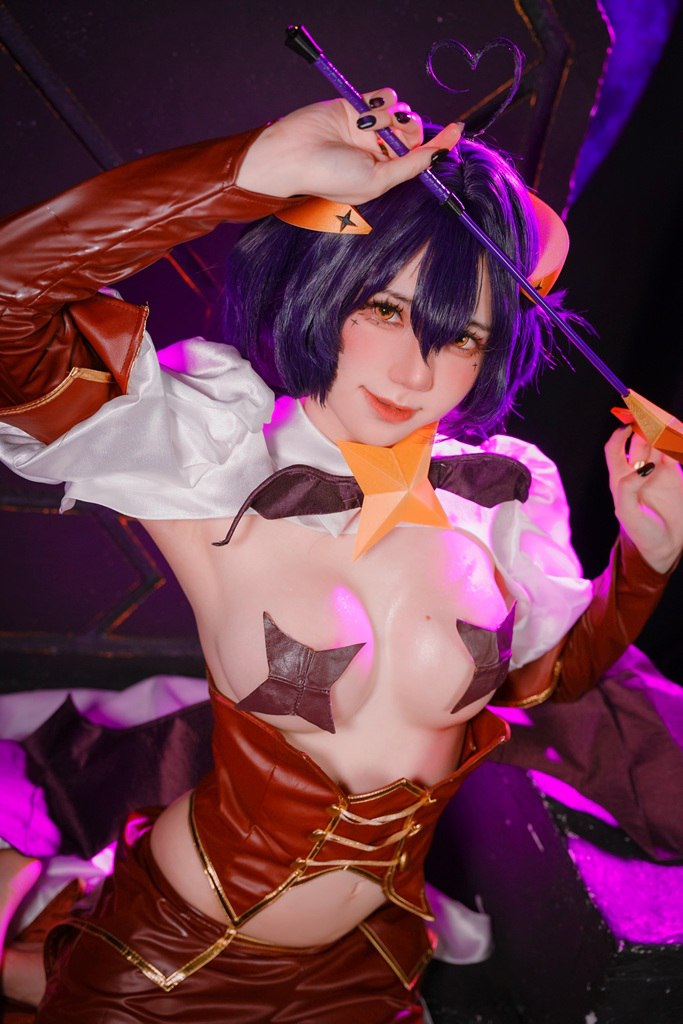 Demonic Cosplayer with Bare Breasts and Pasties Sexy demon cosplayer posing provocatively with bare breasts and playful pasties.