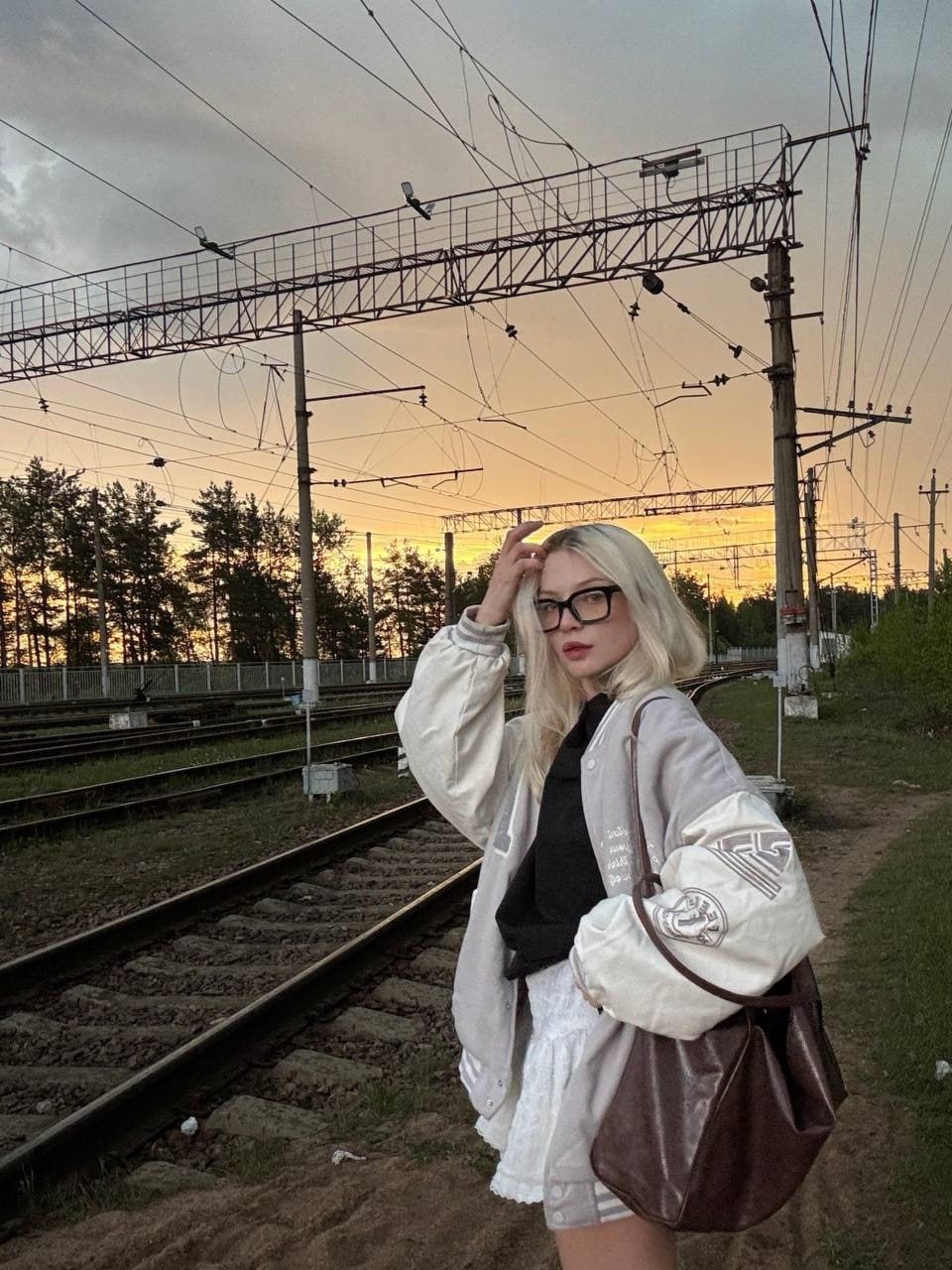 Sexy Blonde Babe by Railway Tracks at Sunset Sexy blonde babe waiting for a hot hookup by the railway at sunset.