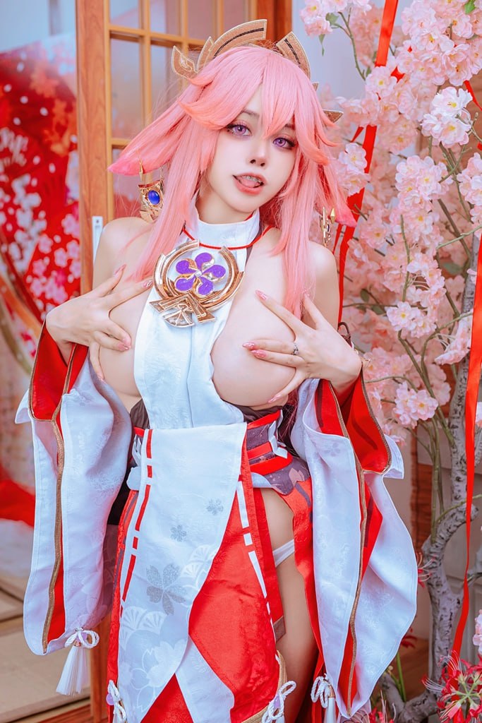 Sexy Cosplay Girl in Bikini Stunning cosplay of a cute anime babe showing off her big tits and juicy vulva in a traditional setting.