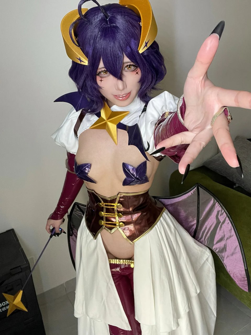 Succubus Cosplay Naked Breast Babe Purple-haired babe cosplaying succubus showing off her luscious bare breasts and tantalizing curves in a sexy outfit.